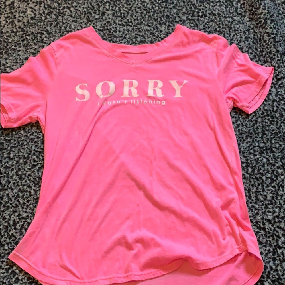 A bright pink shirt from the brand "Awake".